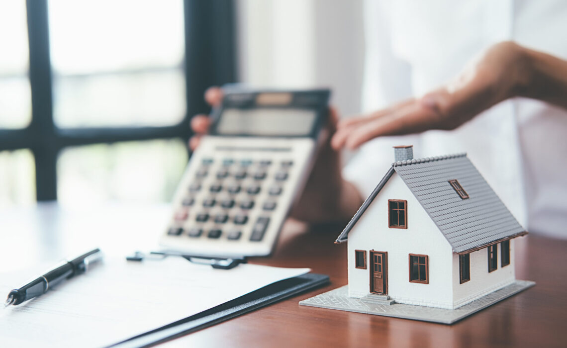 House Model With Real Estate Agent And Customer Discussing For C