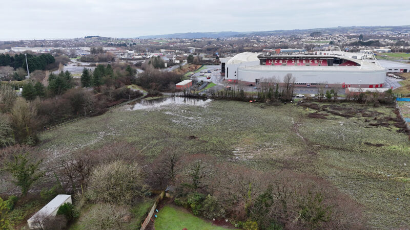Aerial view of building site in Llwynhendy with Parc y Scarlets and Trostre in background