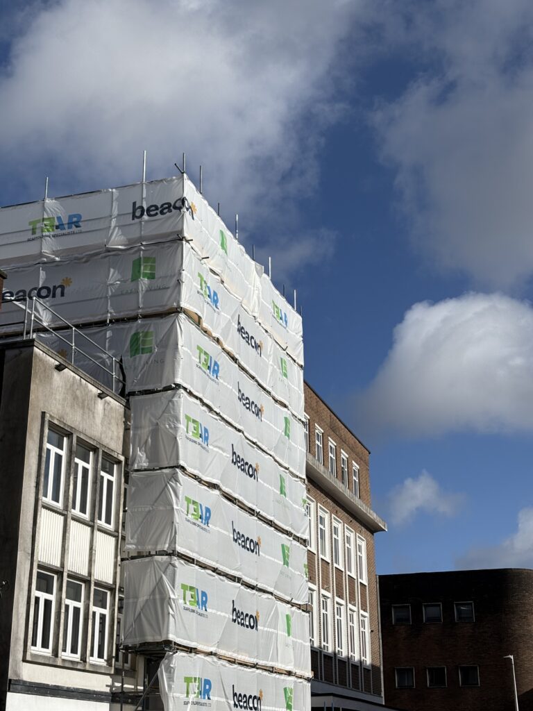 Street view of 61 Kingsway / Park Street Lofts, in development with scaffold wrap all around
