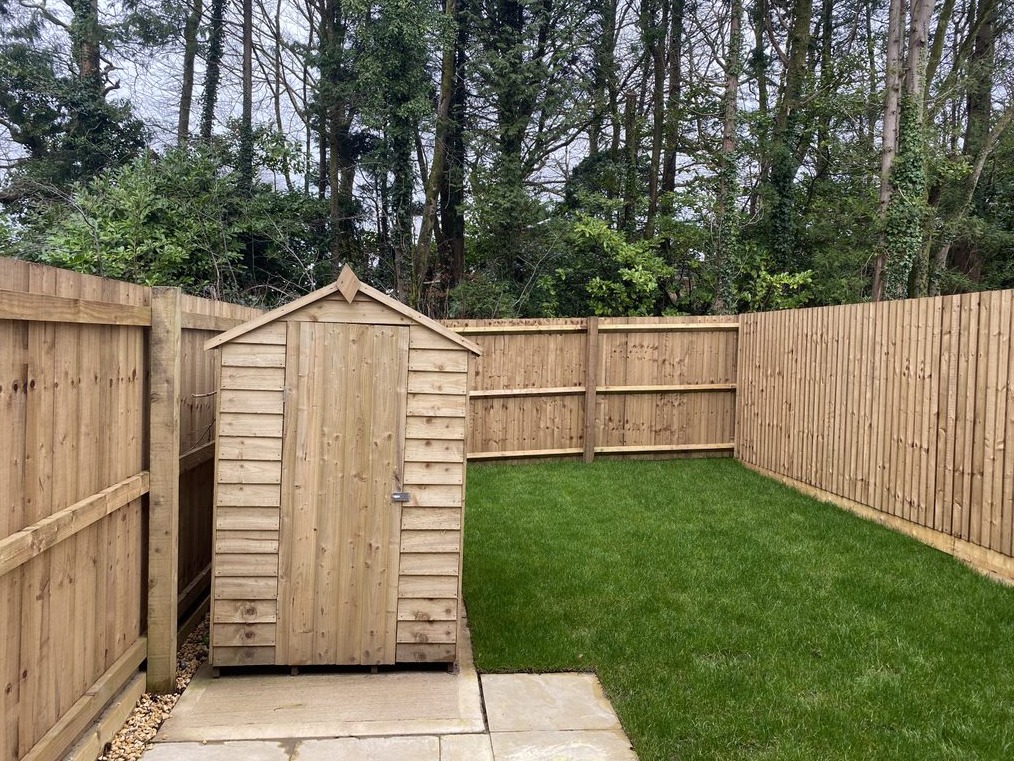 Rear garden at Hendrefoilan Park with a shed