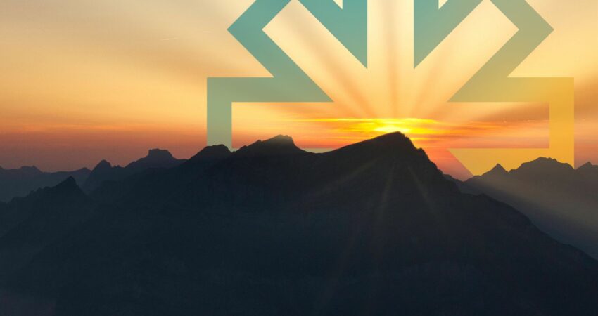 Beacon logo rising with sun behind a mountainous landscape
