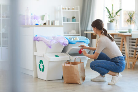 Woman Sorting rubbish In The Kitchen