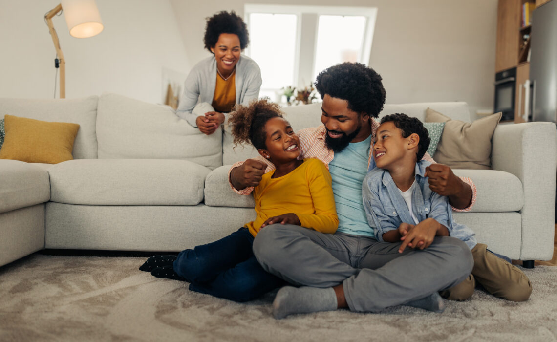 Parents And Their Children Bonding At Home