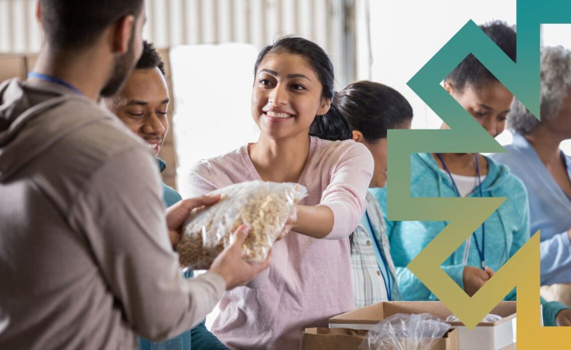 Woman handing over a bag of rice at a foodbank with Beacon logo element