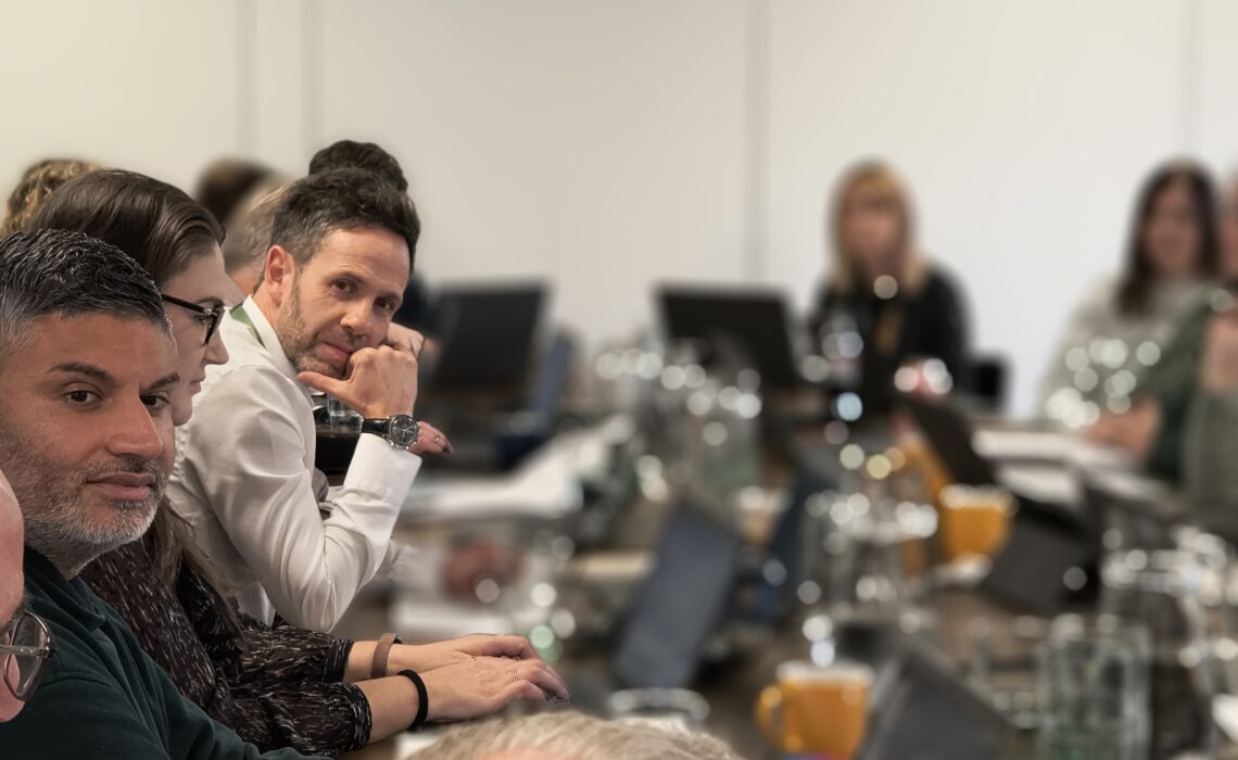 board members taking at a meeting