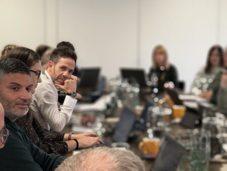 board members taking at a meeting