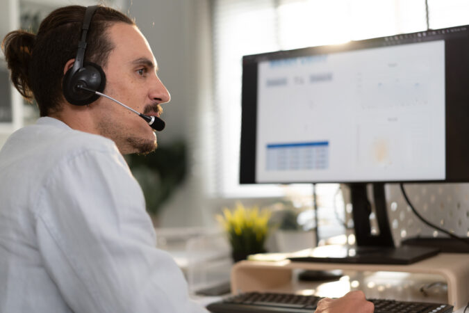 Male Customer Service Operator Wear Headset Working In an office